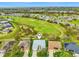 An aerial view of the home backing onto the community golf course at 26821 Augusta Springs Cir, Leesburg, FL 34748