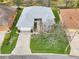 Aerial view of a single-story home with a manicured lawn, a driveway, and established landscaping at 26821 Augusta Springs Cir, Leesburg, FL 34748