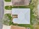 Bird's eye view showcases a home's roof, landscaping, driveway, and surrounding trees in a residential neighborhood at 26821 Augusta Springs Cir, Leesburg, FL 34748