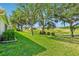 Green backyard that backs onto a community golf course at 26821 Augusta Springs Cir, Leesburg, FL 34748