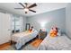 bedroom featuring twin beds with fun decorations at 26821 Augusta Springs Cir, Leesburg, FL 34748