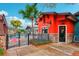 A view of Chatham's building exterior and a pool with palm trees visible at 26821 Augusta Springs Cir, Leesburg, FL 34748