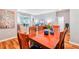 Inviting dining room with hardwood floors and access to the patio at 26821 Augusta Springs Cir, Leesburg, FL 34748