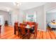 Charming dining room featuring a wood table, wood chairs, and a window with natural light at 26821 Augusta Springs Cir, Leesburg, FL 34748