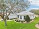 Beautiful house showcasing a well-groomed lawn and elegant landscaping at 26821 Augusta Springs Cir, Leesburg, FL 34748