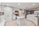 Bright and modern kitchen featuring white cabinetry and stainless steel appliances at 26821 Augusta Springs Cir, Leesburg, FL 34748