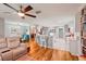 Spacious living room with adjacent kitchen and modern decor at 26821 Augusta Springs Cir, Leesburg, FL 34748