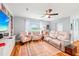 Comfortable living room with a ceiling fan and lots of natural light at 26821 Augusta Springs Cir, Leesburg, FL 34748