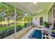 Relax in this screened lanai with ceiling fans and scenic views of lush golf course at 26821 Augusta Springs Cir, Leesburg, FL 34748