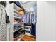 This walk-in closet offers ample storage and organization solutions at 26821 Augusta Springs Cir, Leesburg, FL 34748