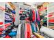 View of a fully stocked walk-in closet with shelving and hanging racks at 26821 Augusta Springs Cir, Leesburg, FL 34748