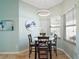 Bright breakfast nook featuring a round table, stylish lighting, and natural light at 288 Bent Oak Ct, Leesburg, FL 34748