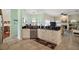 Modern kitchen featuring black granite countertops and white cabinets at 288 Bent Oak Ct, Leesburg, FL 34748