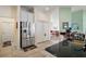 Spacious kitchen with stainless steel refrigerator and ample storage space at 288 Bent Oak Ct, Leesburg, FL 34748