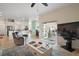 Open-concept living room with access to the kitchen, dining area, and an outdoor patio at 288 Bent Oak Ct, Leesburg, FL 34748