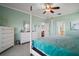 Bright primary bedroom boasts a four-poster bed, carpet, and ample closet space for storage at 288 Bent Oak Ct, Leesburg, FL 34748