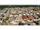 Aerial view of neighborhood with similar style homes and well-maintained landscaping at 3076 Gulfport Ct, The Villages, FL 32163