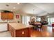 Bright combined kitchen and living room area featuring hardwood floors and recessed lighting at 3076 Gulfport Ct, The Villages, FL 32163