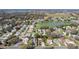 An aerial view shows the neighborhood, a lake, and mature landscaping at 314 Chula Vista Ave, Lady Lake, FL 32159