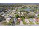 An aerial view shows the neighborhood, a lake, and mature landscaping at 314 Chula Vista Ave, Lady Lake, FL 32159