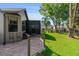 Outdoor patio area, with shade coverings, mature trees and well manicured lawn at 314 Chula Vista Ave, Lady Lake, FL 32159