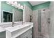 Beautiful bathroom with double sinks, modern tile, walk-in shower and neutral decor at 314 Chula Vista Ave, Lady Lake, FL 32159