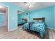 This bedroom has an ensuite mirrored wardrobe, wood floors, and ample space at 314 Chula Vista Ave, Lady Lake, FL 32159