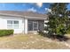 The backyard features a screened lanai and lush green space perfect for relaxation and entertaining at 3201 Sonesta Ct # B, Clermont, FL 34711