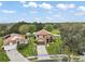 Expansive aerial shot of a single-Gathering home with a well-manicured lawn and a long driveway at 3320 Callerton Rd, Clermont, FL 34714