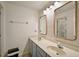 Modern bathroom features a dual sink vanity, and decorative framed mirrors at 3320 Callerton Rd, Clermont, FL 34714