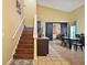 Dining room with a staircase, a kitchen and black barn doors that lead into the living room at 3320 Callerton Rd, Clermont, FL 34714