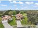 Stunning front exterior view of home with beautiful landscaping and an expansive lawn at 3320 Callerton Rd, Clermont, FL 34714