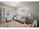 Bright living room with natural light, featuring a modern chandelier and elegant furnishings at 3320 Callerton Rd, Clermont, FL 34714