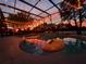 Inviting pool with colorful floats and romantic string lights for evening swims at 3320 Callerton Rd, Clermont, FL 34714