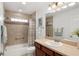 Bathroom features neutral colors, a tub shower and a vanity at 3403 Rabbit Run Path, The Villages, FL 32163