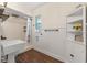 Cozy bathroom featuring a shower, modern sink and cabinet for storage at 36014 Poinsettia Ave, Fruitland Park, FL 34731