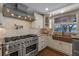 Custom kitchen with stainless appliances, copper sink, and stylish range hood at 36014 Poinsettia Ave, Fruitland Park, FL 34731