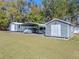 Multiple outbuildings with covered parking and storage options provide versatile utility for the property at 36014 Poinsettia Ave, Fruitland Park, FL 34731