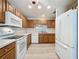 Eat-in kitchen with white countertops and appliances at 3725 Westerham Dr, Clermont, FL 34711