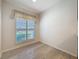 A room with hardwood floors and natural light at 3725 Westerham Dr, Clermont, FL 34711