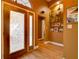 Elegant foyer features decorative glass door, wood flooring, and display shelving at 3733 Plantation Blvd, Leesburg, FL 34748