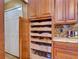 Custom kitchen cabinet with multiple pull out shelving units and a granite countertop at 3733 Plantation Blvd, Leesburg, FL 34748