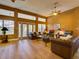 Inviting living room featuring wood-style floors, and ample seating, perfect for entertaining at 3733 Plantation Blvd, Leesburg, FL 34748