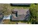 An aerial view reveals a well-maintained roof and mature trees surrounding the property at 3773 Eversholt St, Clermont, FL 34711