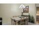 Dining room with table and chairs under a chandelier, with neutral colors and a calming atmosphere at 3773 Eversholt St, Clermont, FL 34711