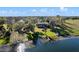 Aerial view of the lakefront property showcasing the house and surroundings at 37734 N County Road 44A, Eustis, FL 32736