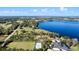 Beautiful lakefront land featuring mature trees, a home, and serene water views at 37734 N County Road 44A, Eustis, FL 32736