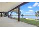 Covered back porch area boasting beautiful lake views and mature trees at 37734 N County Road 44A, Eustis, FL 32736