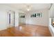 Bedroom featuring hardwood floors, a closet with mirrored doors and a large window at 37734 N County Road 44A, Eustis, FL 32736