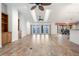 Bright living room featuring ceiling fans and views of the water through large sliding glass doors at 37734 N County Road 44A, Eustis, FL 32736